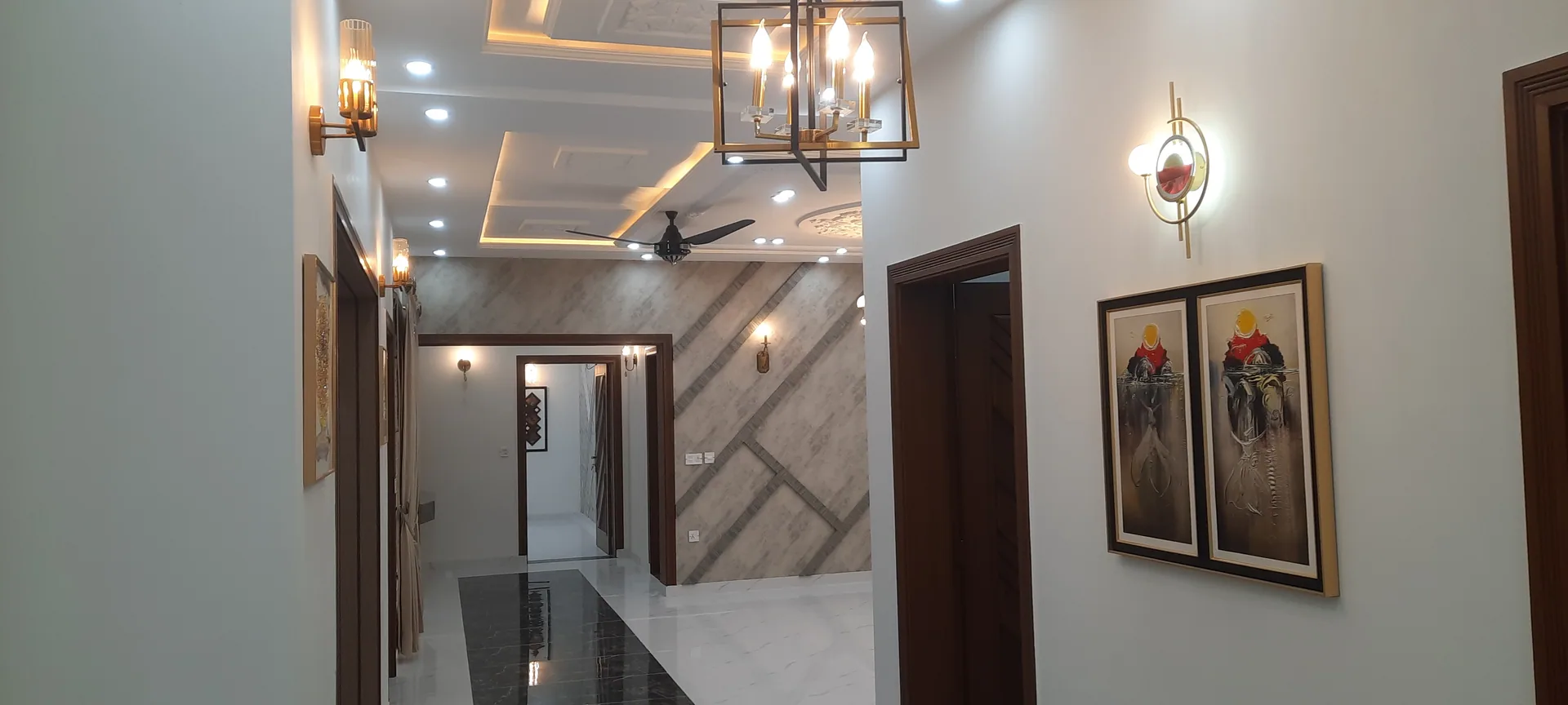 36 Jehlum — lit hallway ceiling, DC Colony Gujranwala