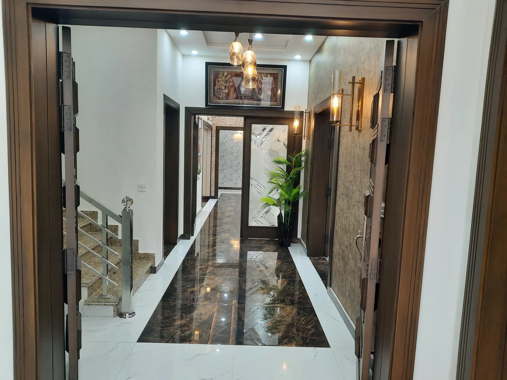 82 Jehlum — marble entry hallway, DC Colony Gujranwala