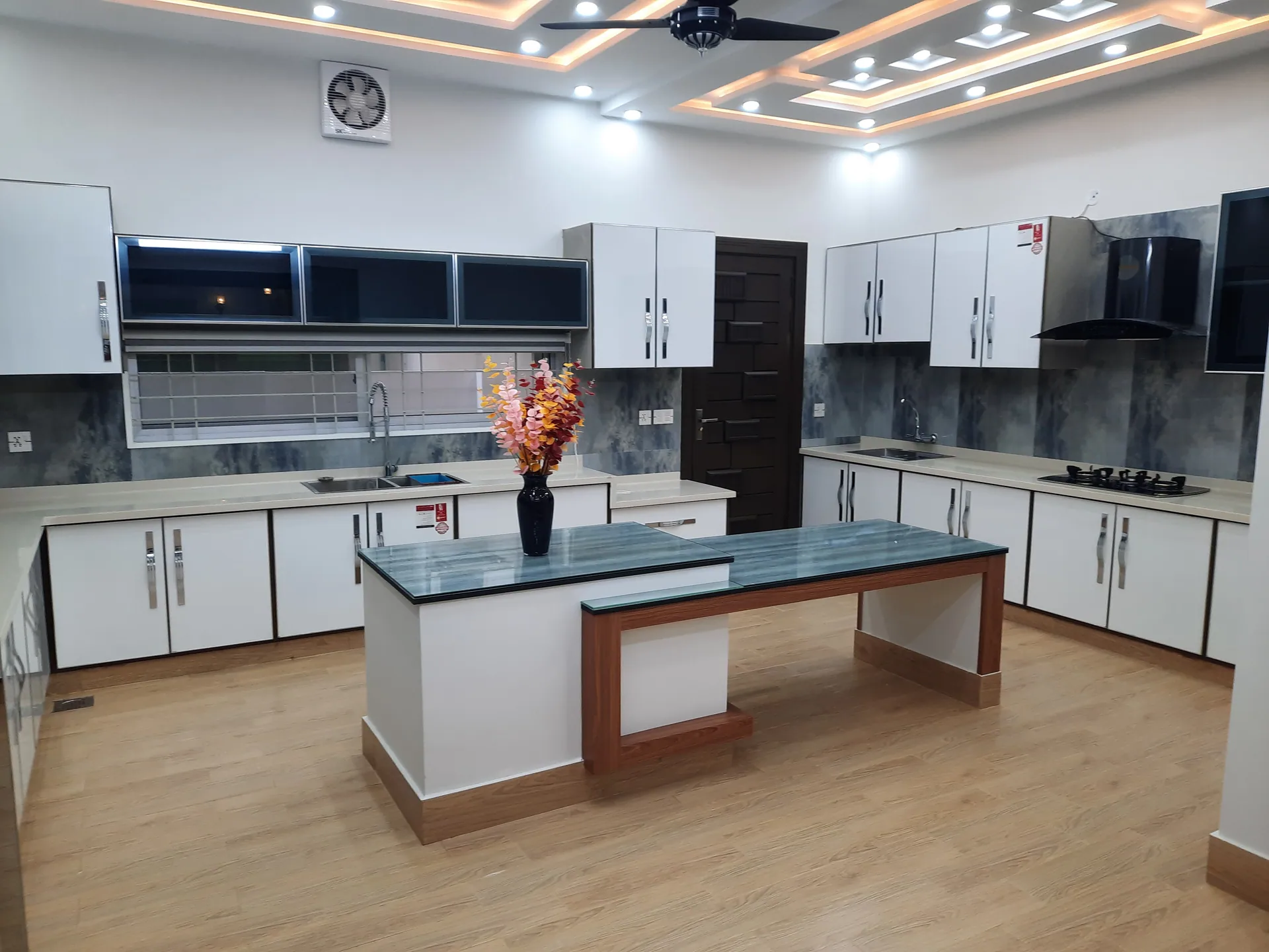 82 Jehlum — modern white kitchen, DC Colony Gujranwala